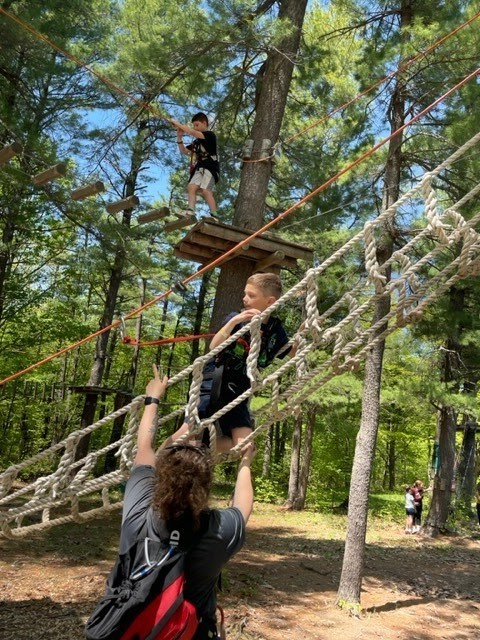 Students on rope bridge