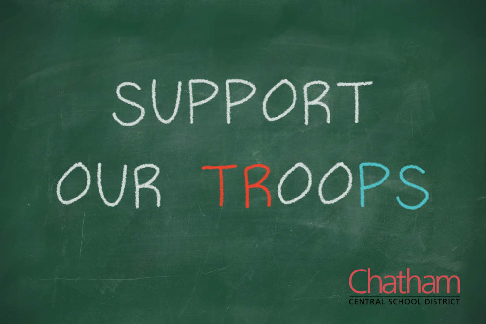 chalkboard with Support Our Troops written on it