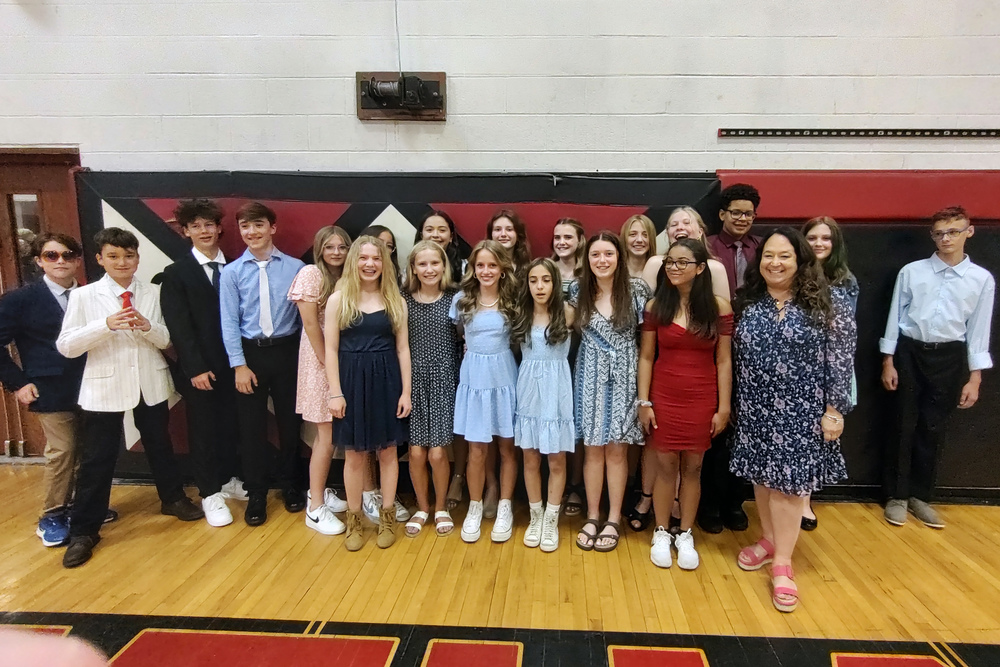 NJHS inductees pose for photo in gym