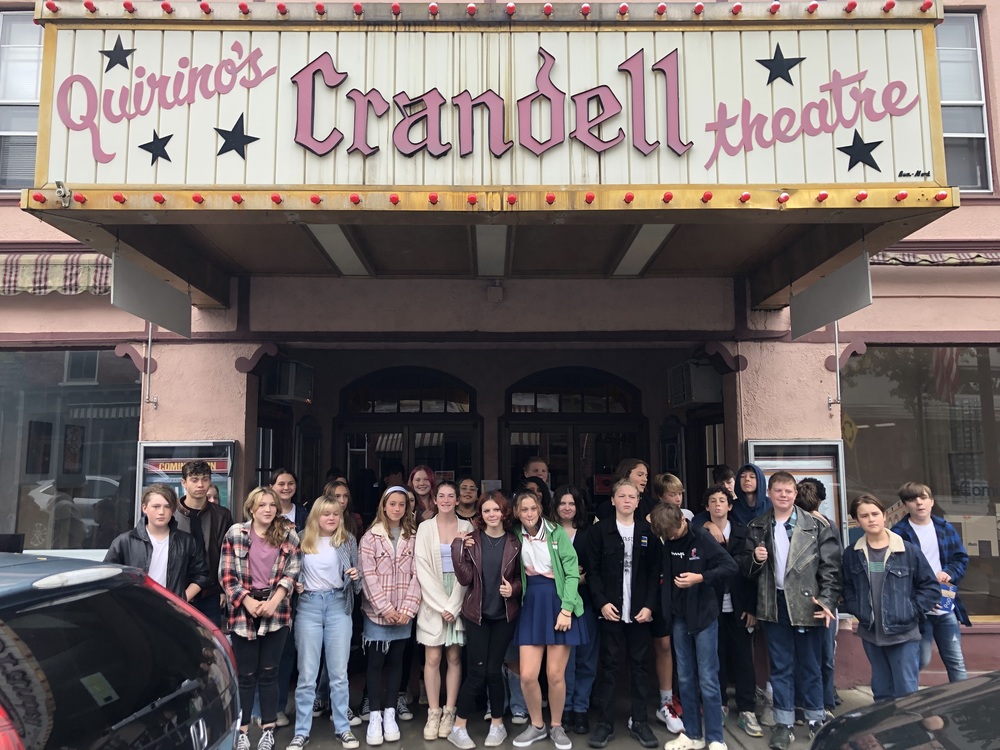 Students dressed as Greasers & Socials in front of Crandell Movie Theatre