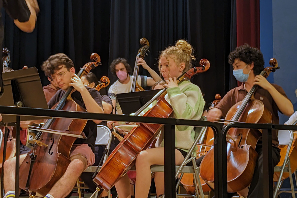 orchestra students playing on stage