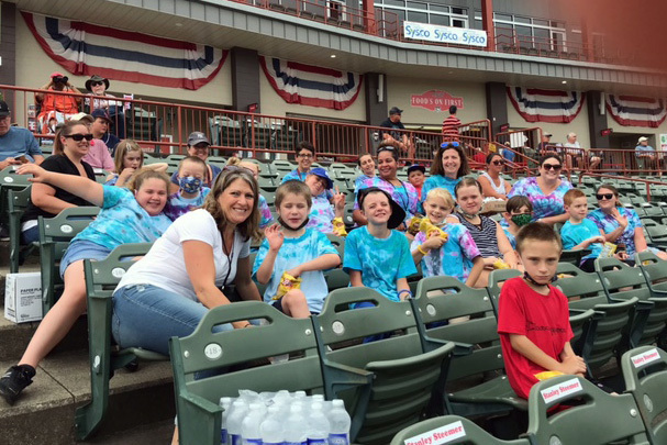 Students and teachers in stadium seating