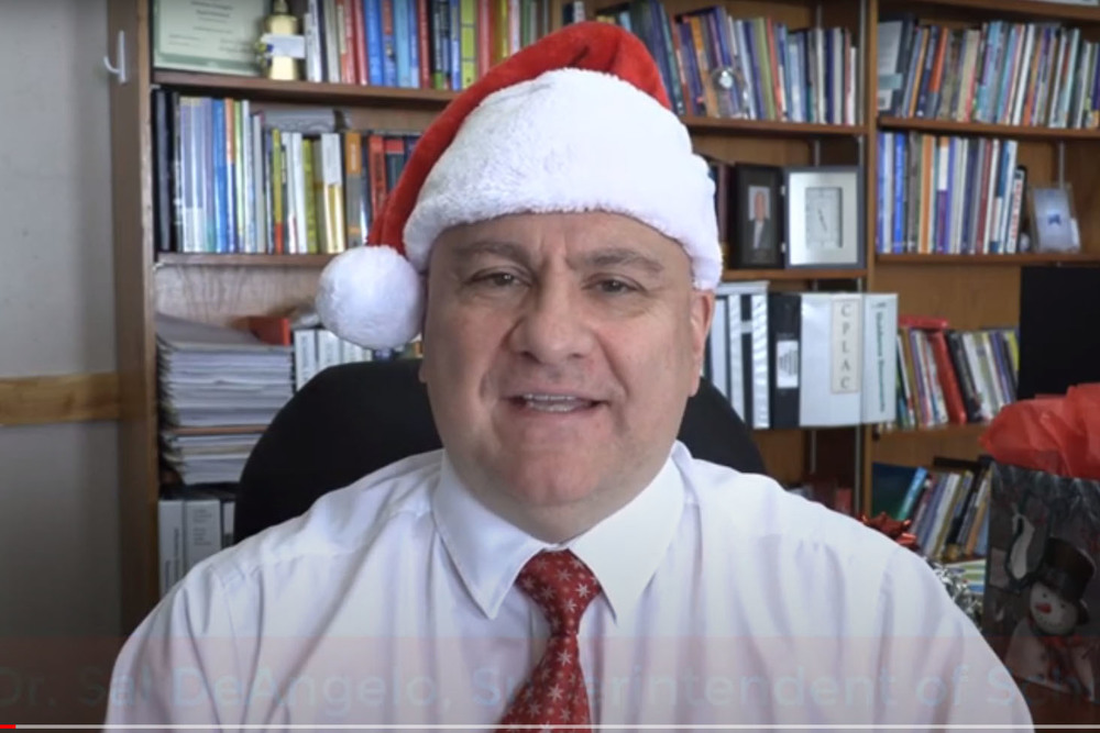 Dr. Sal DeAngelo wearing Santa hat