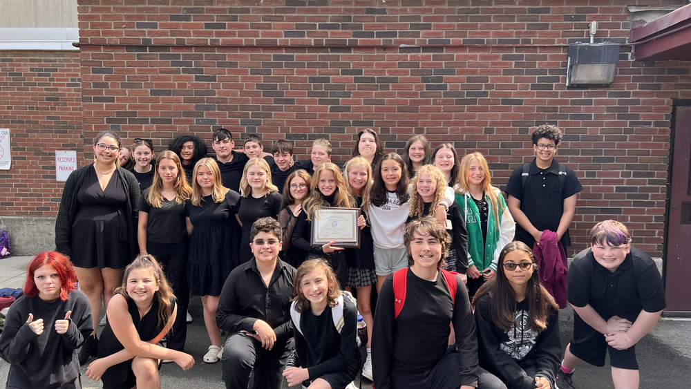 grade 7/8 chorus pose with award