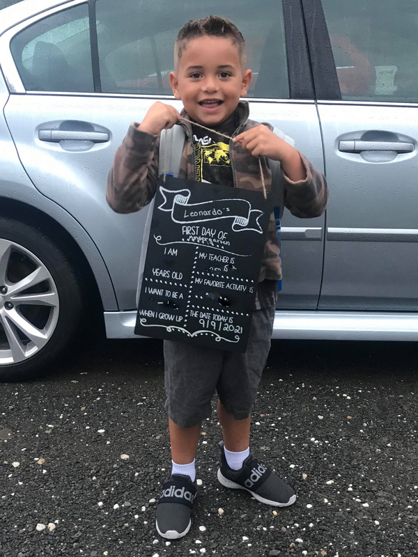 Boy holding sign 