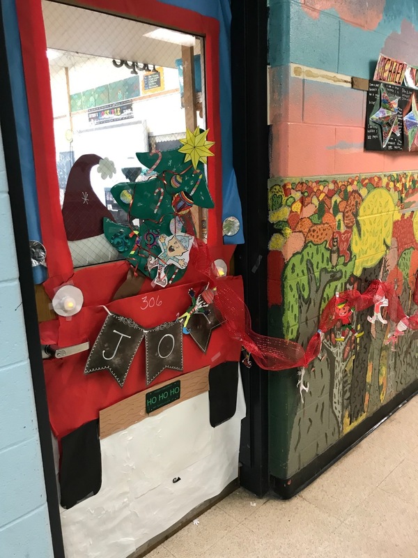 Door decorated as car with tree and presents 