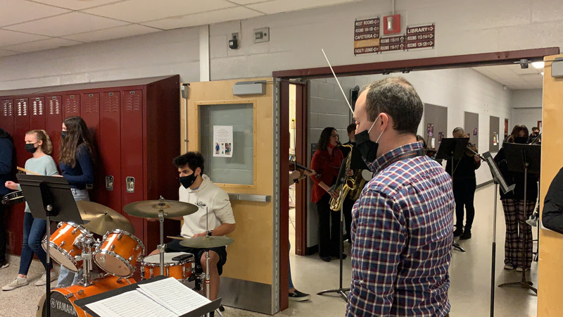 Students playing instruments in hall