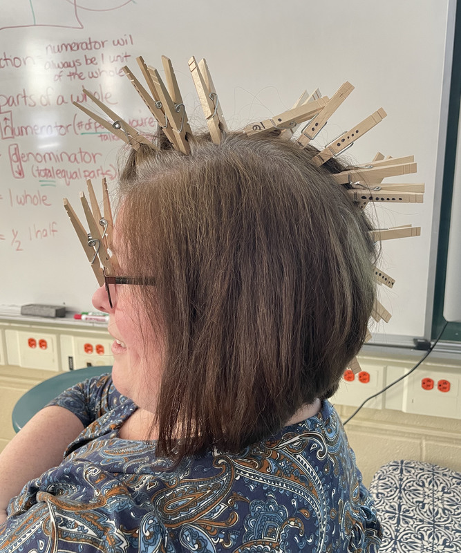 Mrs. Maraglio with clothes pins in her hair