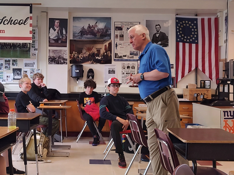 man speaking to classroom of students