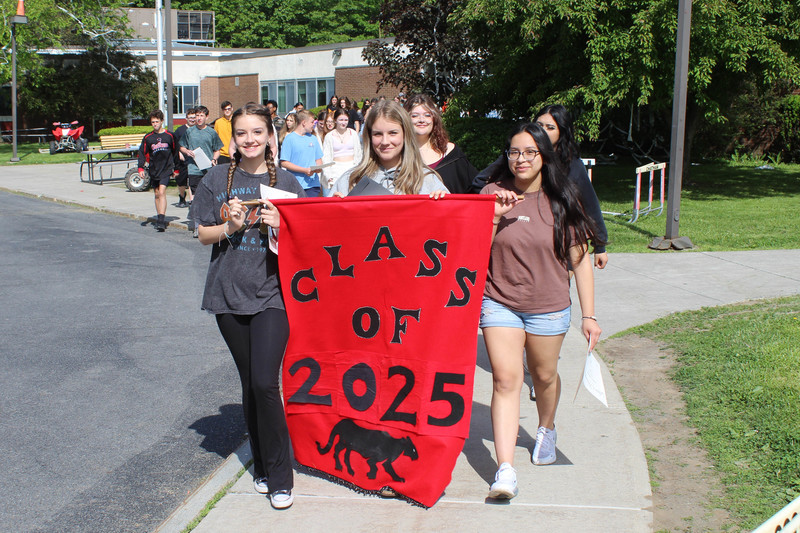 girls holding Class of 2024 banner