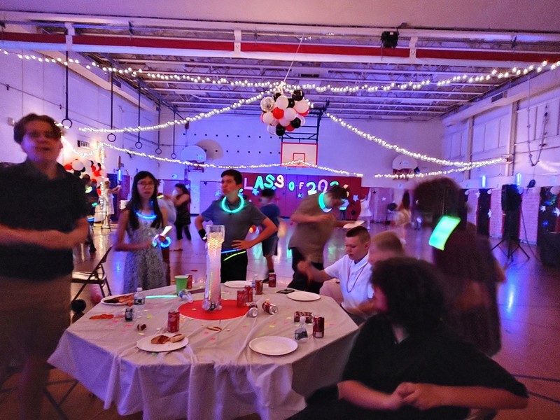students around table at dance