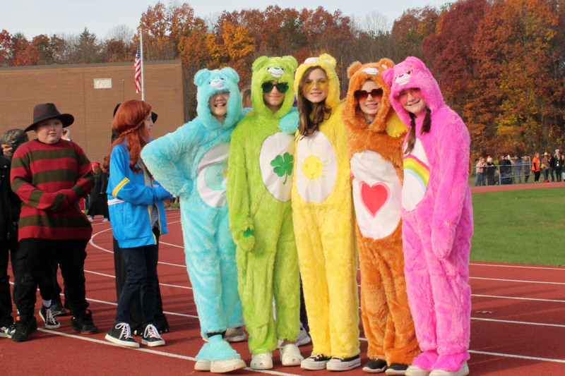 five girls dressed as care bears