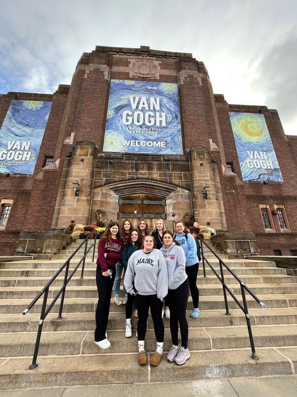 students on steps of Van Gogh exhibit