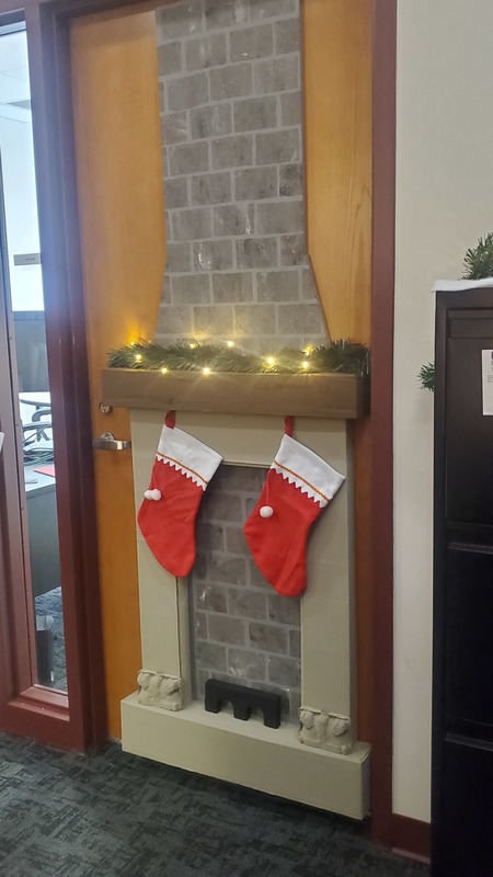 dor decorated as chimney with stockings