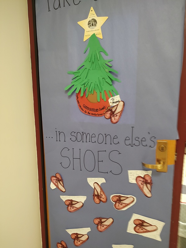 Door decorated with shoes and tree