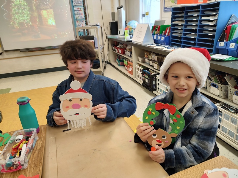 seventh and second graders working on crafts together