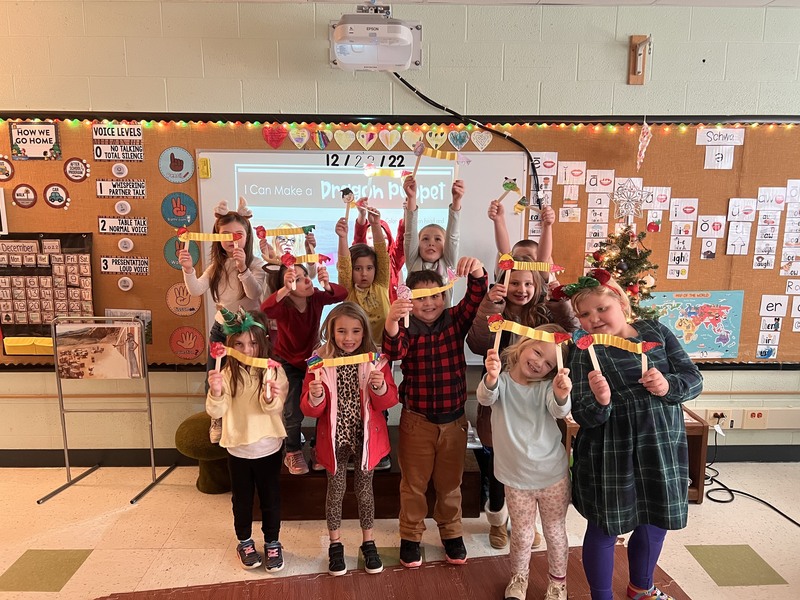 Class holding holiday decorations