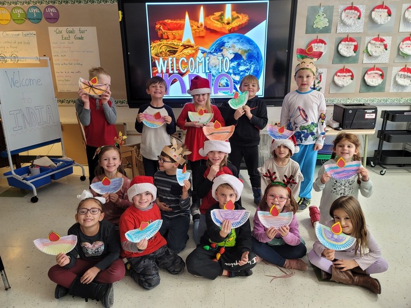 Class holding holiday decorations