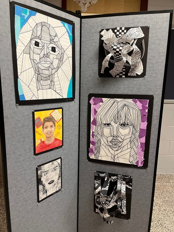 art display of black and white portraits
