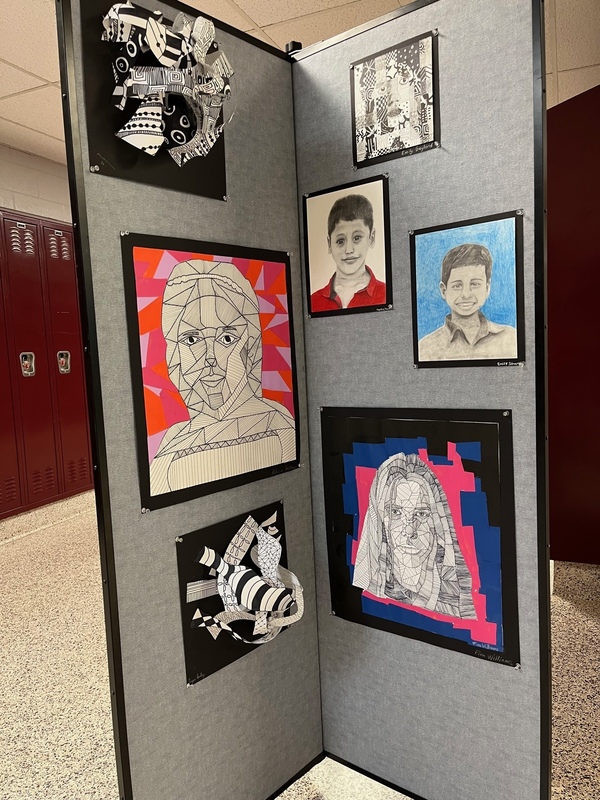 art display of black and white portraits