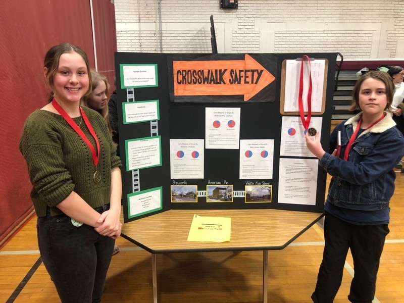 girl and boy wearing medals next to Crosswalk Safety Project