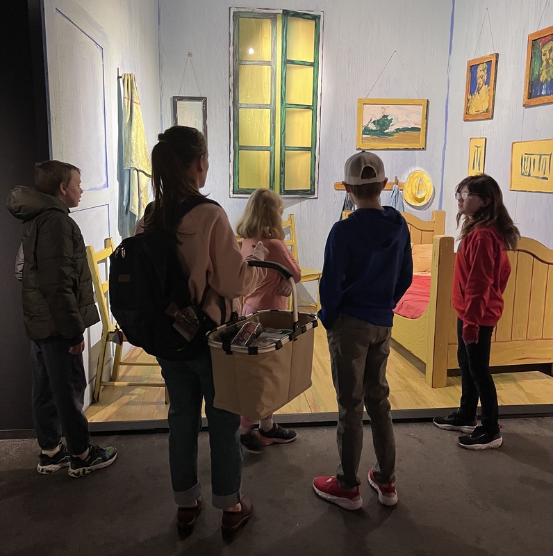 students look at Van Gogh exhibit