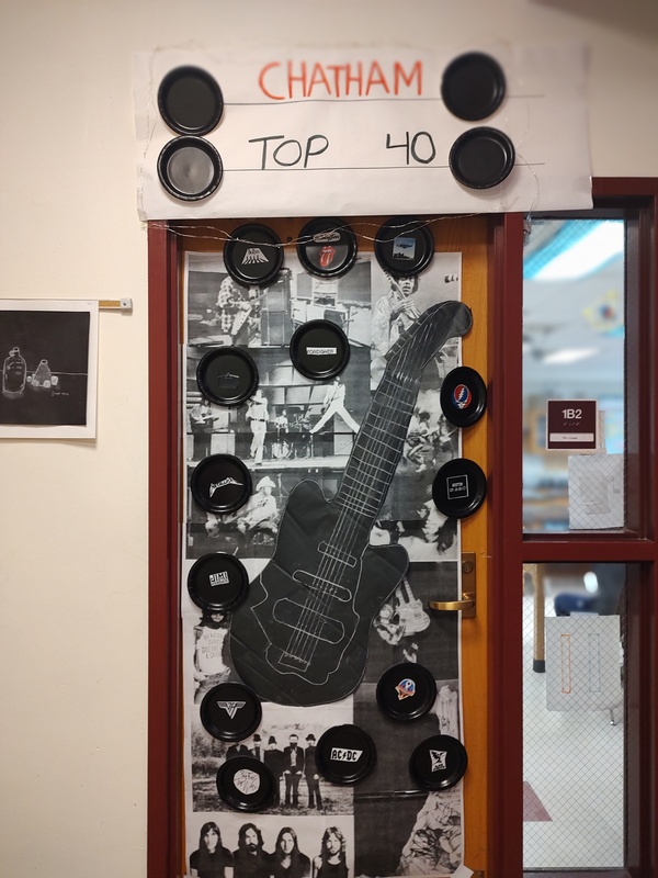 door with records and guitar on it