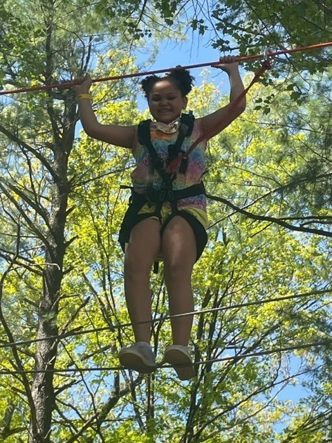 girl on ropes course