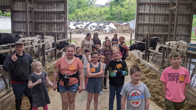 group photo of classes in dairy barn