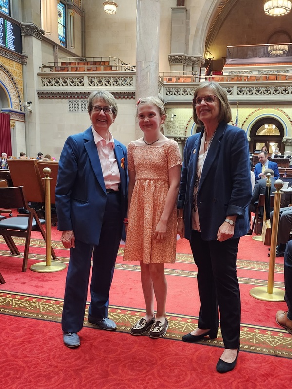 girl standing with state assembly members