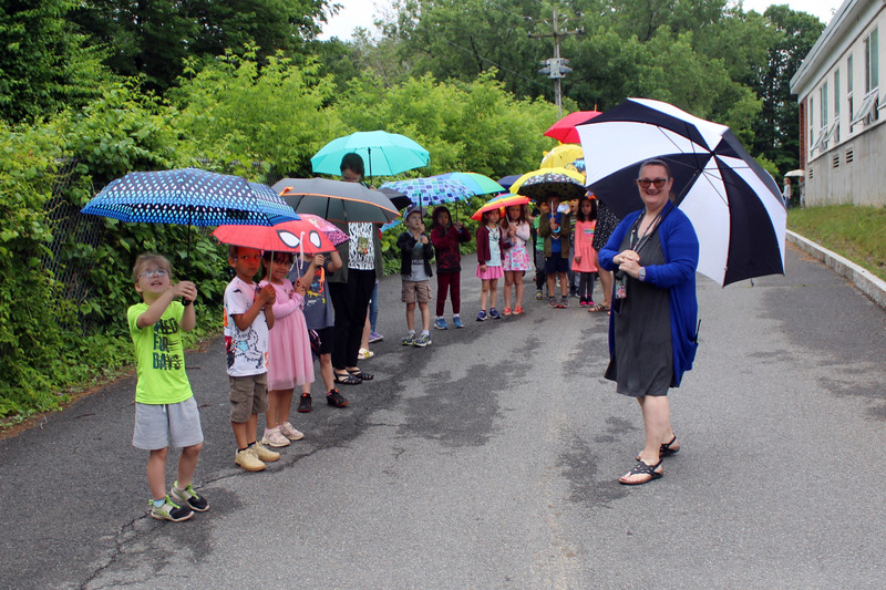 students line up for umbrellas parade