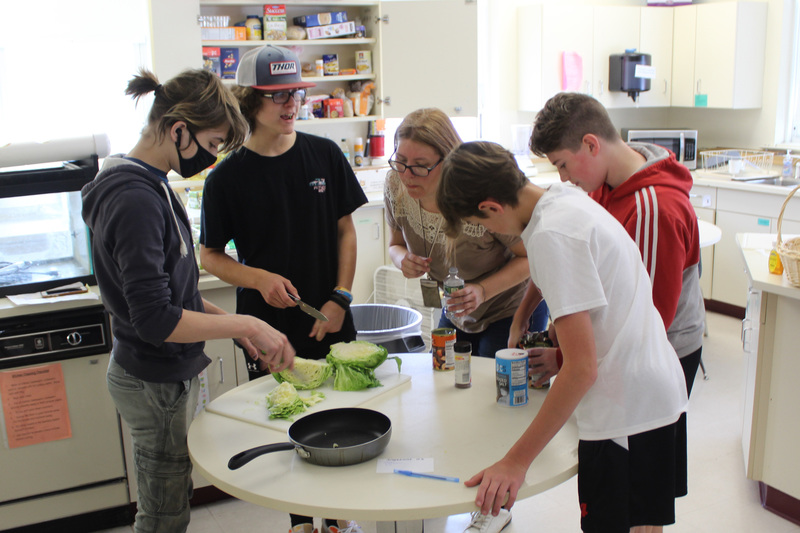 students cooking meal 