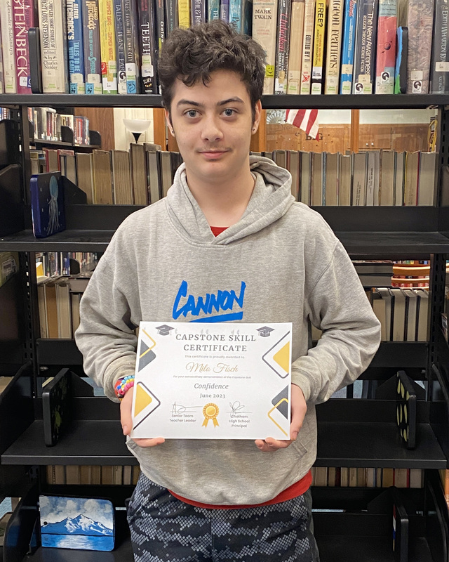 student holding certificate